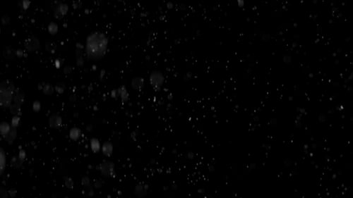 Schneit auf schwarzem Hintergrund