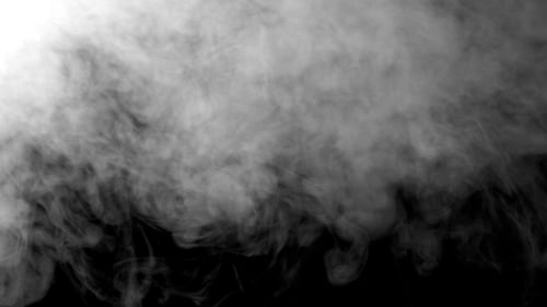 Gray Smoke Billowing on a Black Background