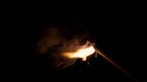 Match Stick Burning in the Dark