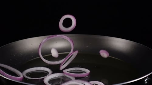 Purple Onion Rings Sizzle in Frying Pan