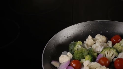 Fresh Vegetables Broccoli, Cauliflower, and Tomatoes Cooking