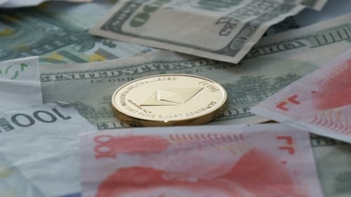 Ethereum Cryptocurrency Coin on a Bed of Global Currency