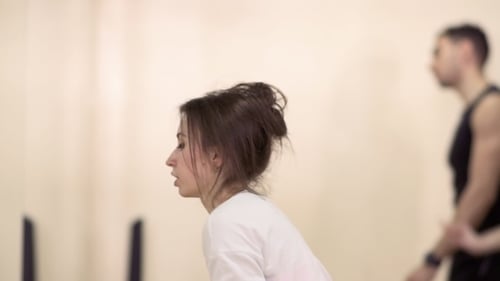 Woman Warm Up with Leg Extension in Gym