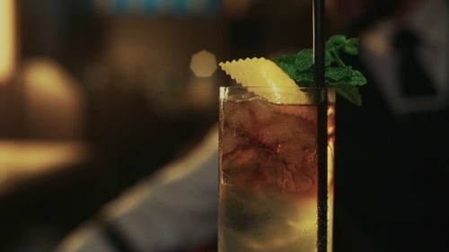 Refreshing Cocktail with Lemon and Mint Garnish