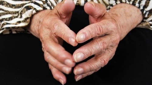 Close Up of Senior Woman Clasping Wrinkled Hands