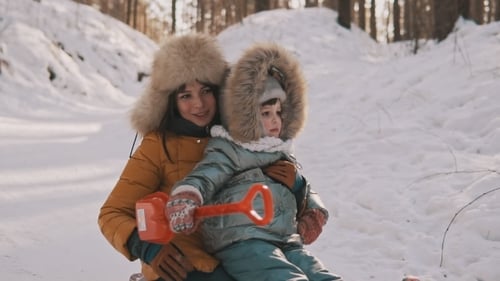 Young Mother and Little Daughter Having Fun on Sledge in Winter Park