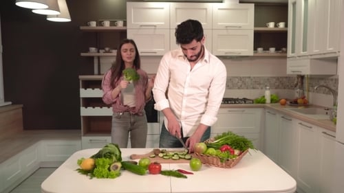 Couple Cooking Fresh Vegetables Together in Modern Kitchen