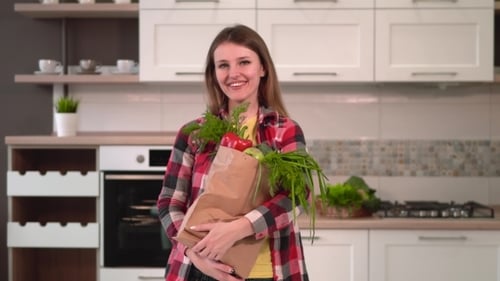 Woman Holds Shopping Pack
