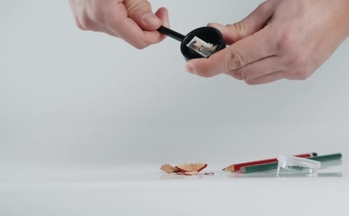 Wooden Colorful Pencils with Sharpening Shavings, on White Background Studio