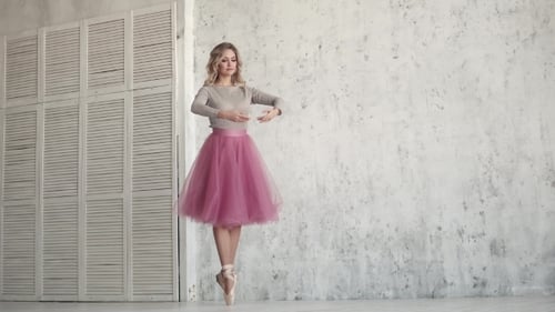Ballet Dancer Spinning on Her Toes in Pointe Shoes and Classical Tutu. Ballerina Dances Classical