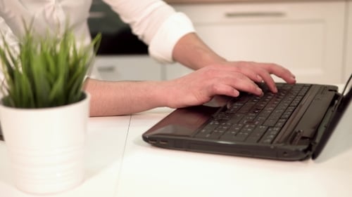 Businessman Works at the Laptop