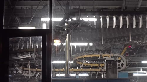 Newspaper Production Lines Seen Through a Window