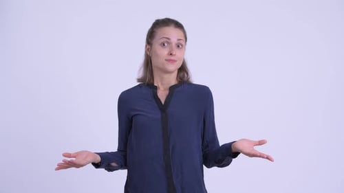 Young Woman Shrugging With Confused Expression