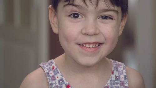 Smiling Child's Expressive Close-Up Portrait Indoors