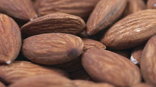 Almond . Rotating Nuts Background
