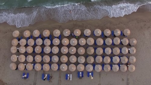 Sunbeds at the Beach with Few People Relaxing There, Aerial View