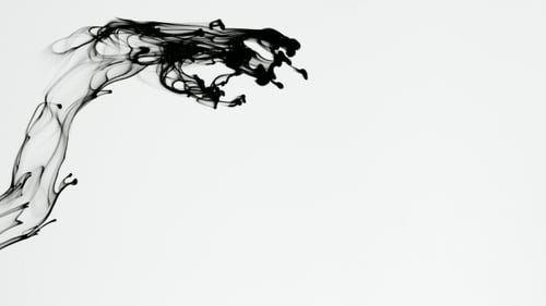Black Ink Flowing in Water on White Background