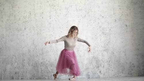 Elegant Ballerina Dancing in Studio