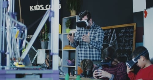 Children Experiencing Virtual Reality in Classroom with Teacher