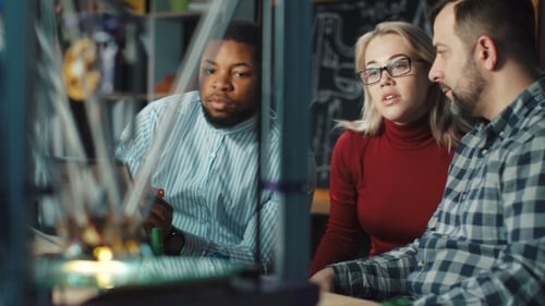 Engineers Watching 3d Printing