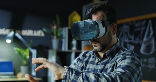 Man Experiencing Virtual Reality Gesturing in an Office