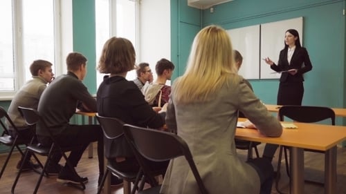 Students and a Teacher Woman During a Lesson in a University Class