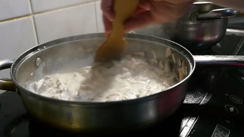 Stirring Mushroom Sauce in a Pan on Stovetop