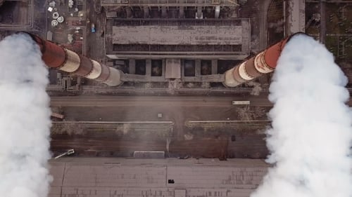 Aerial View of Industrial Plant with Smoking Chimneys