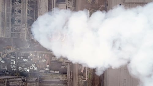 Aerial View of Industrial Complex with Smokestack