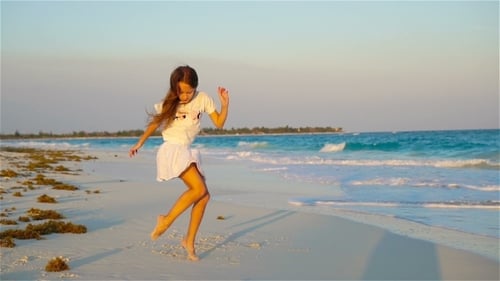 Active Little Girl at Beach Having a Lot of Fun