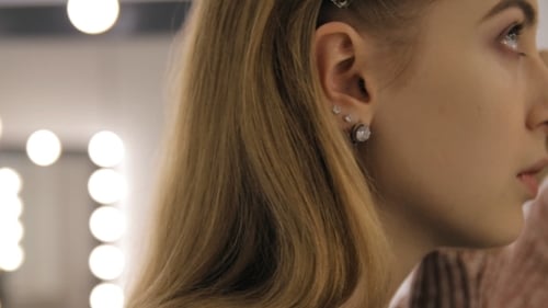 Makeup Artist Applies Cosmetics on Young Woman