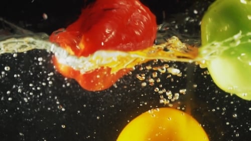 Colorful Bell Peppers Dropping Into Water, Vegetables