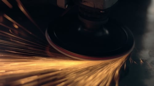 Electric Grinder Smoothing Metal Surface With Sparks