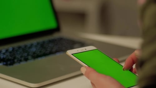 Girl Touches Phone with Green Screen