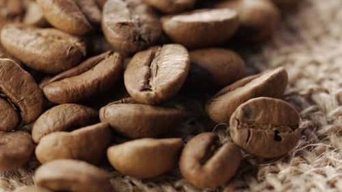 Roasted Brown Coffee Beans on Burlap Close Up