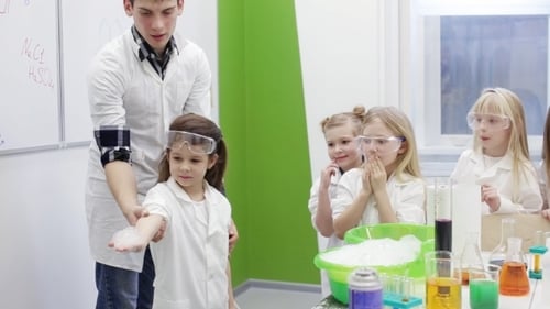 Excited Children Watching Science Experiment with Flames