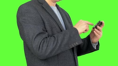 Businessman Using the Smartphone Alpha Channel, Keyed Green Screen