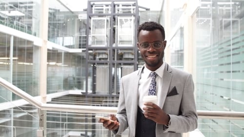 Portrait of Confident Businessman in Modern Office.
