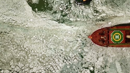 The Ship Sails Through the Sea Ice in the Winter