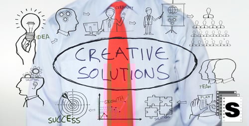 Writing Creative Solutions Concept on Clear Surface