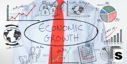 Man Writes Economic Growth on Clear Surface