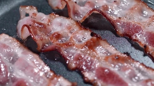 Bacon Sizzling in Hot Pan, Close Up