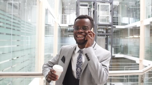 Handsome Businessman Using Smartphone in The Office.