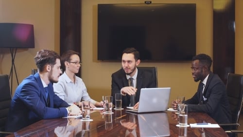 Diverse Business Team Meeting in Modern Office Boardroom