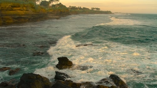 Wave Come to the Rocky Beach at Bali, Indonesia