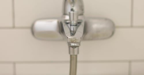 Silver Faucet Dripping Water, Close Up