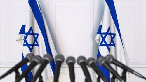 Israeli Official Press Conference Featuring Flags of Israel