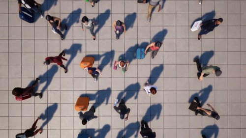 Aerial View of Anonymous Crowd Walking on Tiled Ground Loop