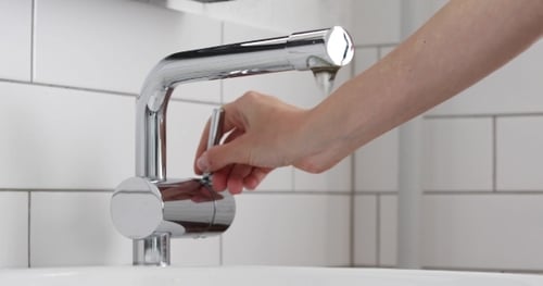 Washing Hands With Water at a Sink