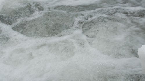 of Water Stream with White and Transparent Bubbles.
